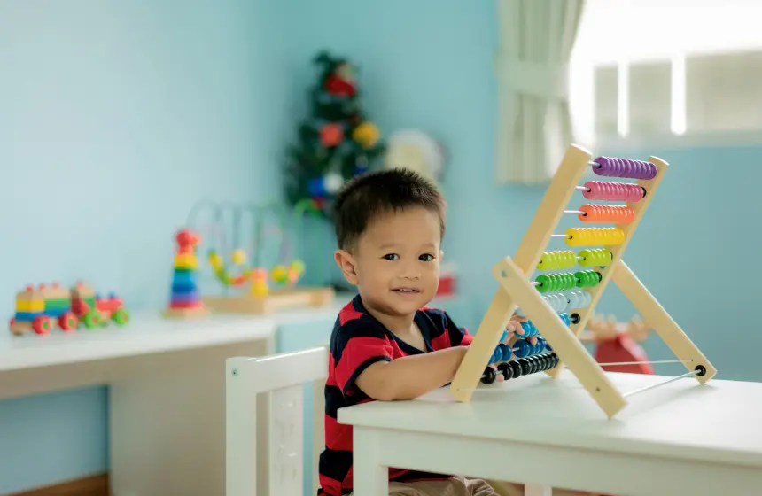 Toddler baby boy learns to count